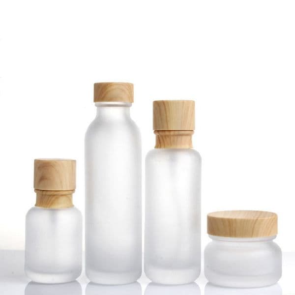wholesale Frosted Glass Jar Cream Bottles Round Cosmetic Jars Hand Face Lotion Pump Bottle with wood grain cap