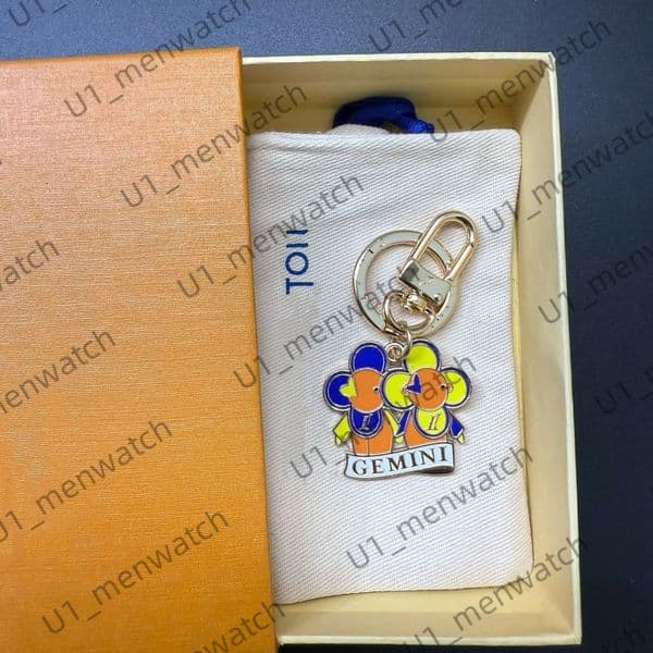 Designer L Letter the twelve zodiac signs sunflower Keychain Vivie pouch bag Designer charm Mini Wallets Classic letter coin purse stylish Metal bags keychain AAAAA