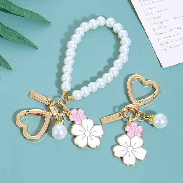 Two-tone cherry blossom alloy keychain pendant, cute flower letter pearl accessory, earphone case bag decoration hanging chain
