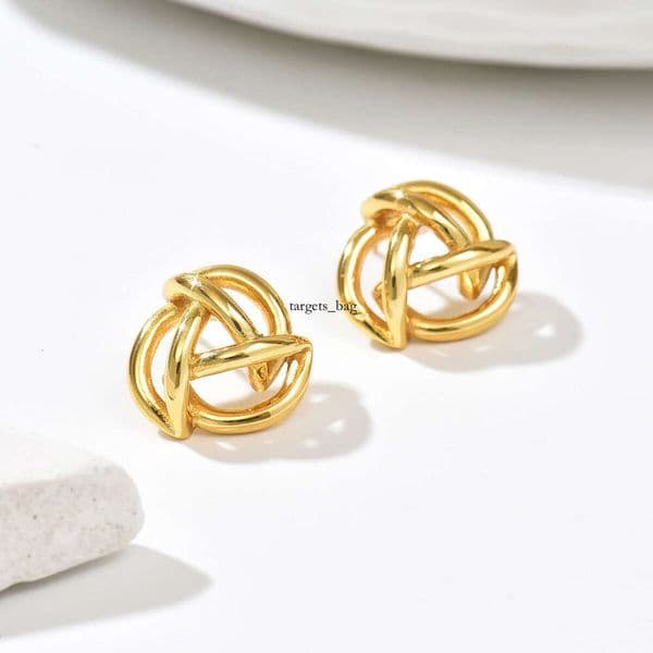 Jewelry minimalist geometric twisted gold-plated hollow earrings niche design commuter earrings