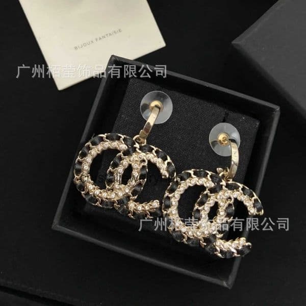 Designer Jewelry cc earrings Womens black leather cord earrings with detailed floral design channels studs