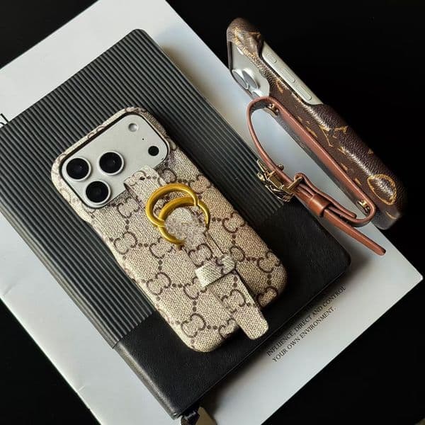 Fashion designer phone case suitable for 17 16 Pro Max 15 14 Pro leather embossed metal logo luxury phone case detachable wristband back cover protective cover AAA
