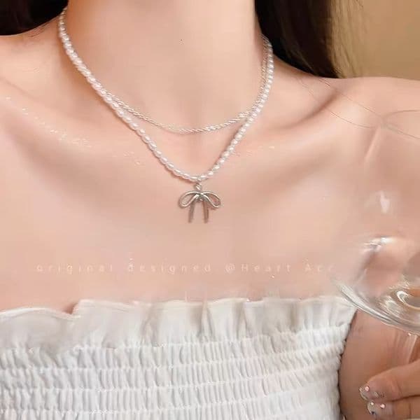 Double-layer bow pearl necklace for women 2024 new model, light luxury collarbone chain, high-end, elegant, versatile, sweet choker