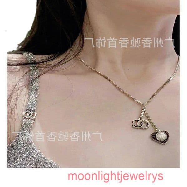 Designer Necklace cc necklace pHeart-shaped necklace with diamond embellishments channels necklace