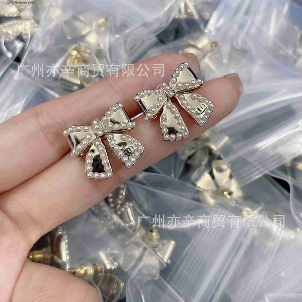Designer Channel Style cc crafted high-end double C letter smooth pearl bow earrings for women light luxury earrings