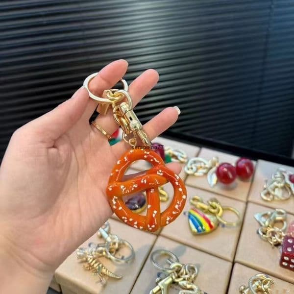 Keychains Lanyards Pretzel mushroom Charm Women Letter Co Designer Keychain Cherry Keychain Bag Charm Decoration Accessory Rings Cherry Resin Lanyards