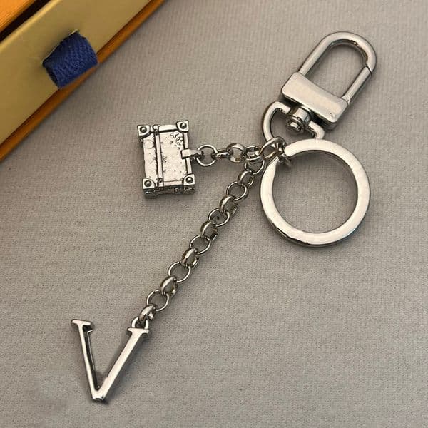 Silver Tone Metal Keychain With Letter Detail And Trunk Pendant Bag cessory And Ideal S260525