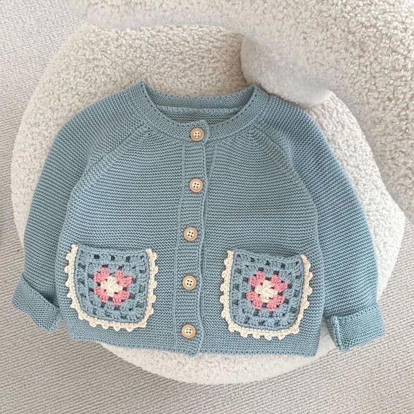 Autumn baby clothing 0-3 year old girls round neck sweater cardigan with hand hook hollow flower pocket jacket 260202