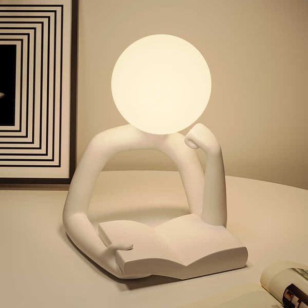 Designed in a light-luxury and minimalist style this resin abstract figure reading lamp serves as a night light and decorative piece for the desktop or bedroomL260529