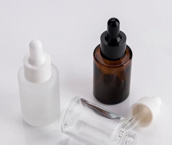 wholesale Wholesale 30ml Flat Shoulder Frosted Clear Amber Glass Round Essential Oil Serum Bottle With Glass Dropper for cosmetics essenc LL