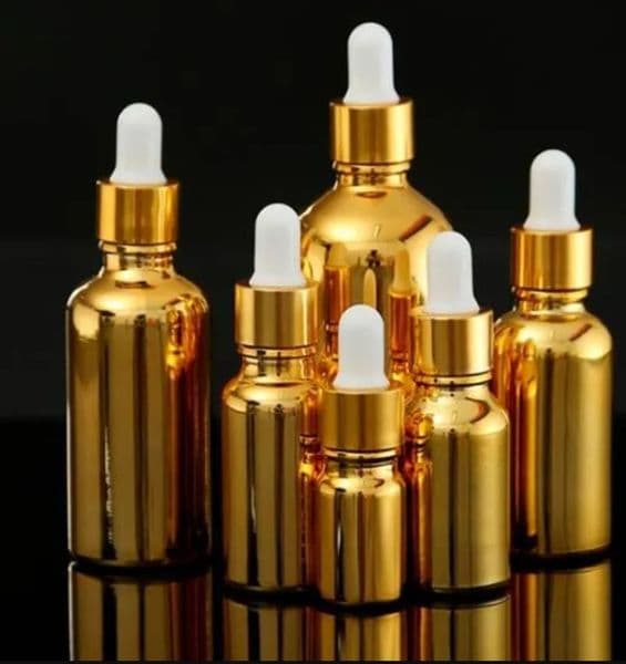 wholesale New Gold-plated 50ml 100ml glass essential oil empty bottle split dispensing bottle glue-head dropper bottle