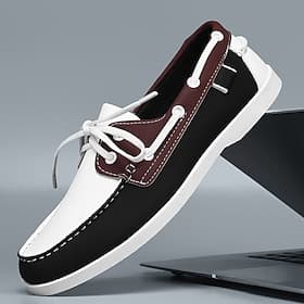 Chaussures bateau bicolores noires et blanches pour hommes avec un design à lacets classique, confortables et élégantes, idéales pour les sorties à la plage, l