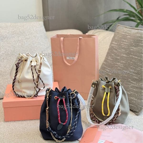 Designer bag Luxury bag Internet Celebrity Same Style Th Autumn Winter Miu New Canvas Bucket Versatile Simple Drawstring Woven Handbag Women S Bag
