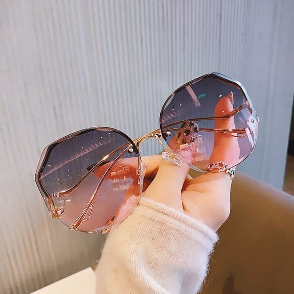 Free Shipping New Fashion Large Frame Rimless Polygonal Metal Curved Temple Trendy Sunglasses For Women