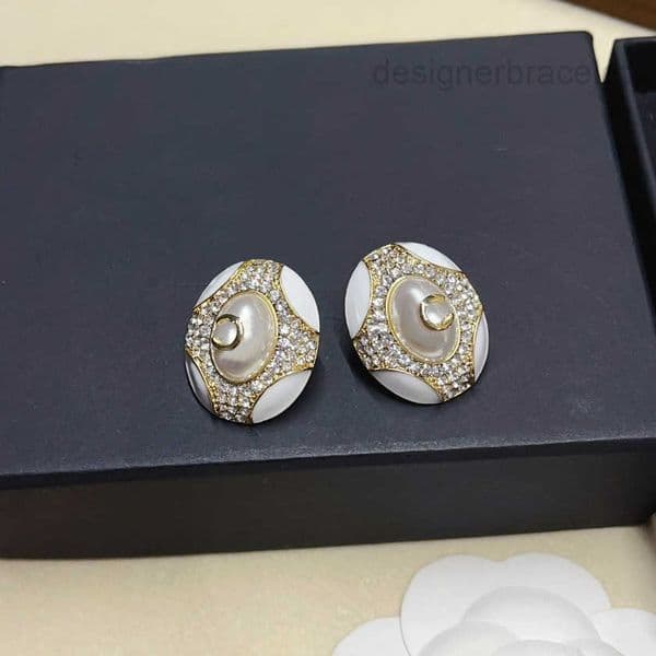 Elegant White Enamel and Rhinestone Earrings with Gold Tone Accents Sophisticated Jewelry for Womens Suitable for Formal Casual Occasions